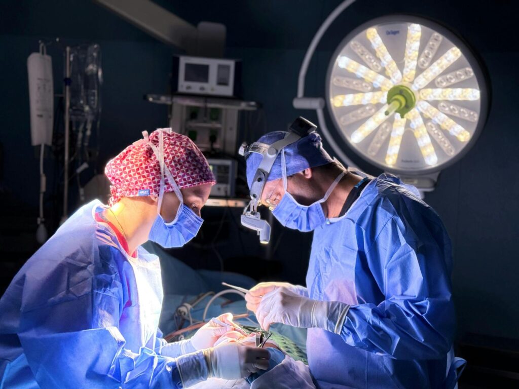 surgical team performing operation in theater